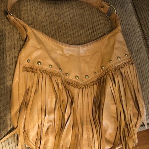 Beige bag with I think it is cold tussel